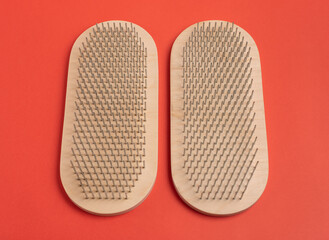 Wooden sadhu boards on a bright red background. 