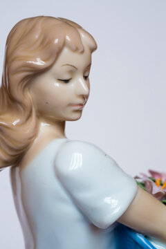 beautiful porcelain doll with flowers