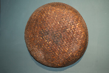 Close-up of a large dustpan hanging on the wall