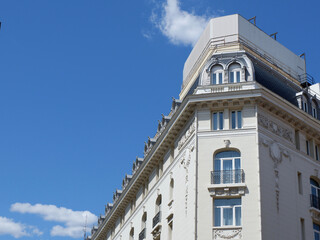 Fototapeta na wymiar Corner of neoclassical elegant building in Barrio de las letras district downtown Madrid, Spain