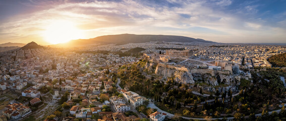 Panoramic sunrise view of the skyline of Athens with Acropolis, Parthenon Temple, old town Plaka...