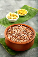 Delicious fresh cooked unpolished red rice porridge , congee served with  curry and pickle. Asian vegan diet foods. 