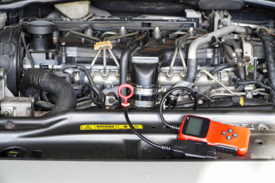 Vehicle Maintenance Auto Service Diagnostic Tool.Car Computer Error Reading Using Mobile Device.
