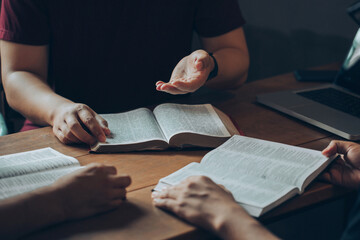 Christian Bible Study Concepts. Christian friend's groups read and study the bible together in a home with window light. followers are studying the word of God in churches.