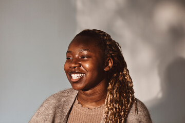 Happy woman looking away against white background