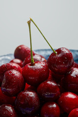 Cherries i in the bowl on white background. Fresh Cherry.