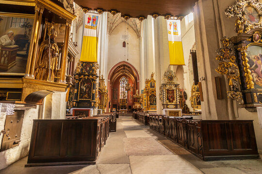 the view inside the church at the altar, benches for people, images of saints. house of god.