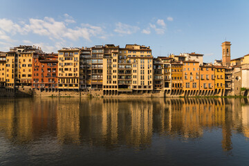 buildings along the Arno river and morning sunshine 