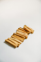 wooden palo santo sticks on a white background, incense set