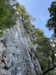 Ladder stairs climbing in sandstone gulch. Climbers path, steel ladder on a rock. Ladder to the sky...