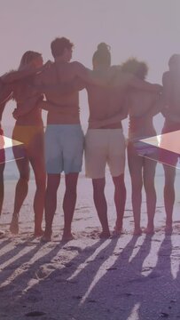 Animation of american flag over diverse group of friends embracing at beach