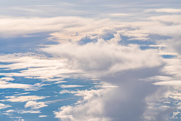 View over the clouds above Tanzania. Bright skyscape