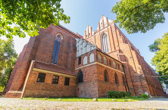 view of the walls of the several-century cathedral built of red brick