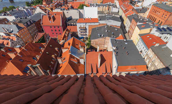 view of the old town of Torun and the Vistula river from above during a warm summer day.