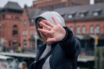 Female hand with rings on a blurred background.
