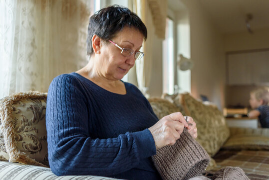 Mature Woman Knitting Hat And Relaxing