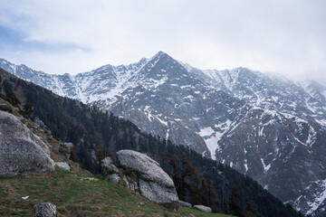 Fototapeta na wymiar Triund Top Dhauladhar ranges and is at a height of 2,828. Triund is situated in the laps of dhauladhar mountains.Himachal Pradesh, India