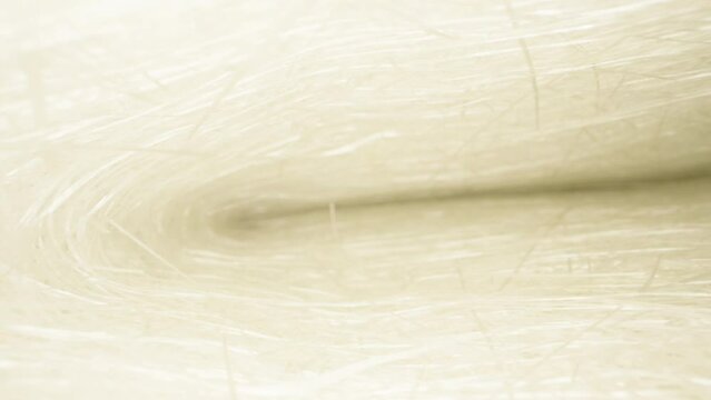 Camera flight inside, under sheets of white fiberglass. Dolly slider extreme close-up. Laowa Probe