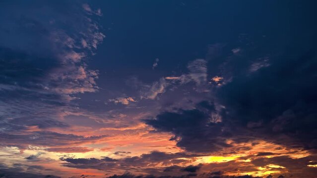 Magnificent sky clouds nature landscape at sunset. Colorful clouds move on the blue sky. 4k sky sunset clouds time lapse.
