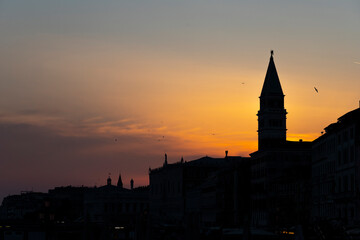 Fototapeta na wymiar Silhouette of San Marco Bell Tower at sunset in Venice, Italy