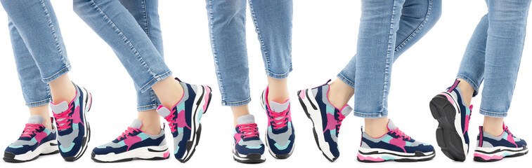 Sneakers on the legs on a white isolated background. Side view from front to back. Shoe display example