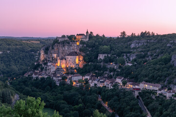 Dust falls on 3 levels of Rocamadour village and first illumination from sanctuaries appears. Lot,...