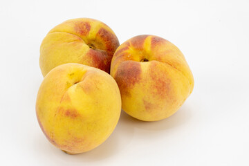 Peaches isolated in white background. Different angles of peach. Shot in studio lighting.  Shot using macro lens. Crystal clear detailing and texture. 