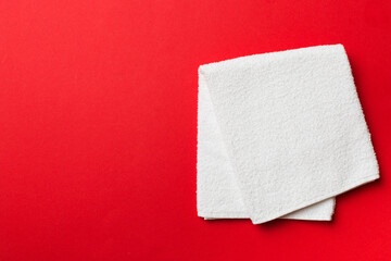 Top view of white towels with copy space on colored background