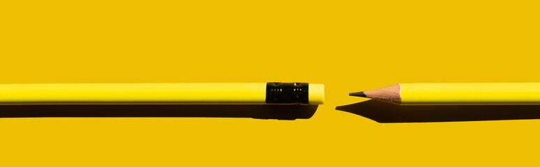 top view of sharp pencils and eraser on yellow background, banner.
