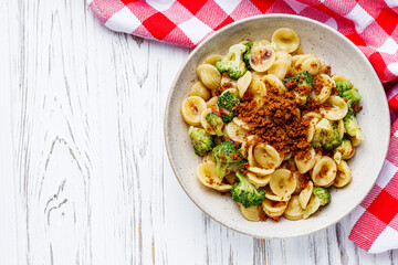orequette pasta with broccoli on a white background