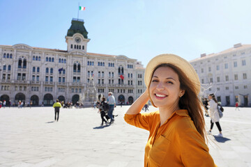 Portrait of traveler girl visiting Trieste city in Italy. Looking at camera. - obrazy, fototapety, plakaty