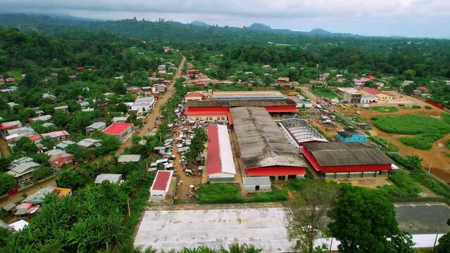 Aerial view around the Bobo Forro market, in Me-Zochi village, Sao Tome - circling, drone shot