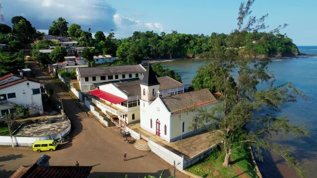 Aerial view around the church of Santana village, during golden hour - circling, drone shot