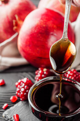 fresh pomegranate sauce narsharab on a black wooden rustic background