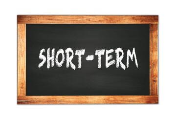 Obraz premium SHORT-TERM text written on wooden frame school blackboard.