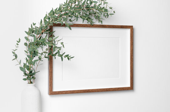 Landscape frame mockup on white wall for artwork, photo, painting or print presentation