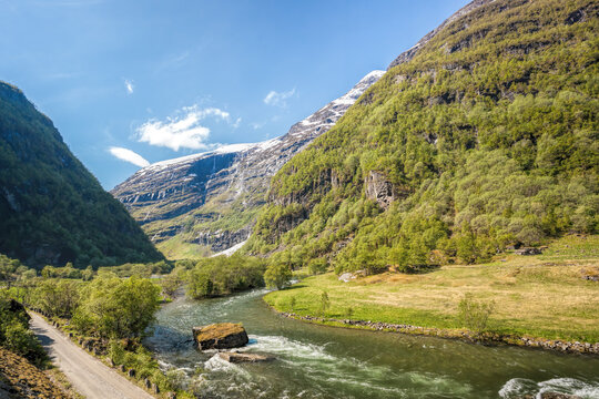 Deep valley with river of Norwegian fjords close the train journey Flamsbana between Flam and Myrdal in Aurland in Western Norway