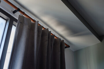 UV resistant gray curtains installed in the bedroom