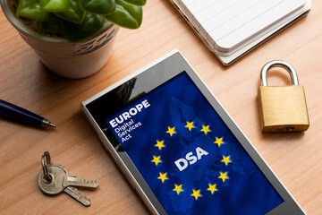 Digital Services Act (DSA) concept. Smartphone with the european map and flag with the text: DSA...