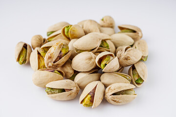 fresh salted pistachios on a white background