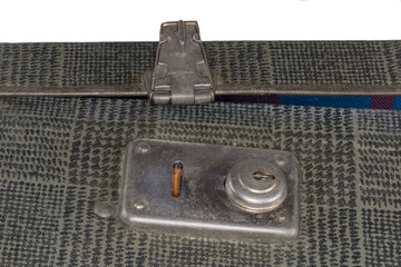 Open inbuilt lock of the old hardshell suitcase close-up