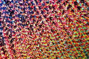 Thousands of bright and colorful origami cranes. Symbol peace and hope.