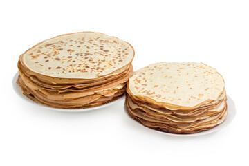 Thin round pancakes two different sizes on the white dishes