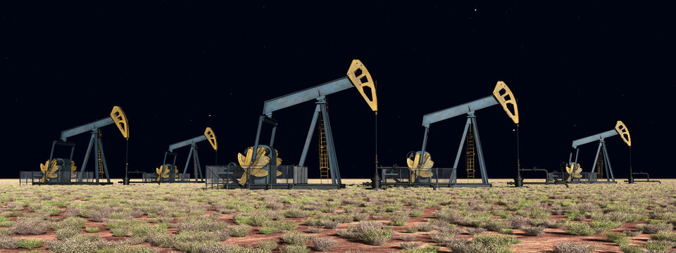 Ölpumpen in einer Landschaft bei Nacht