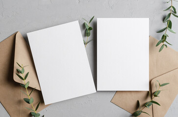 Iinvitation card mockup with envelopes and eucalyptus twigs, front and back sides