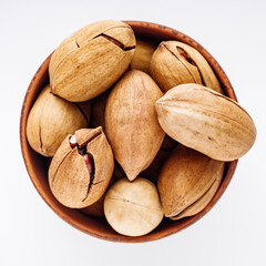delicious fresh pecans on a white acrylic background