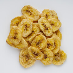 delicious dried banana on a white acrylic background