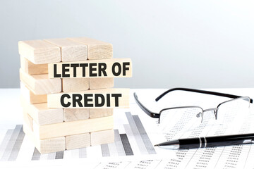 LETTER OF CREDIT is written on wooden blocks on a chart background