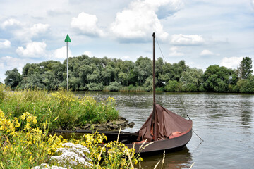 Fishing boat in the Maas. The Netherlands. The Land of Maas and Waal is beautiful to discover on foot or during a bike ride. Netherlands, Holland, Europe