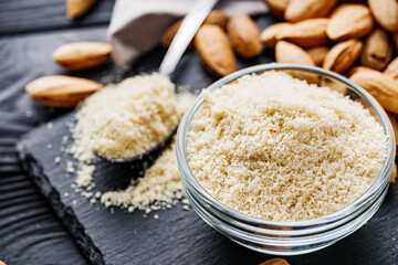 almond flour on a black wooden rustic background